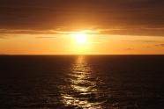 海平面日落天空图片