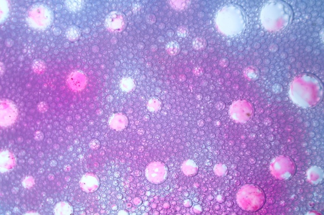 紫色凹凸质感水滴背景图片
