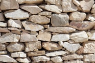 石头堆砌成的石墙背景图片